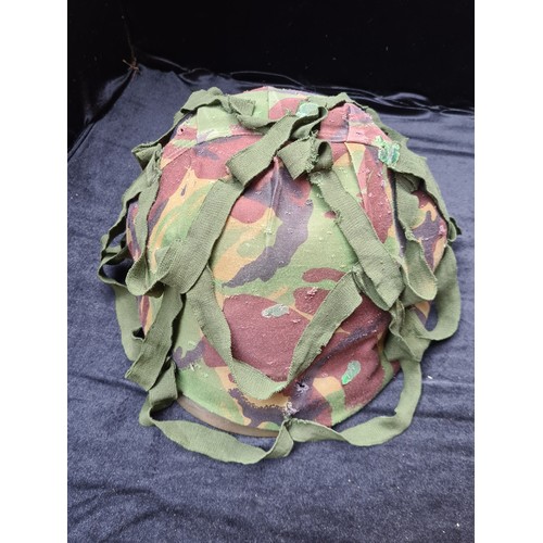 150 - US steel army WW2 helmet with camouflage cover, It looks like there is a kill count inside. It looks... 