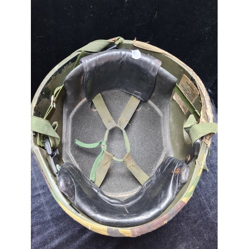 137 - British kevlar military helmet with camouflage
