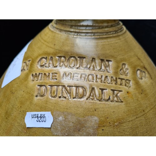 134 - Large antique Irish whiskey jar, No. 5  embossed 'Carolan and Co. Dundalk'. 22 inches (h) Good size ... 