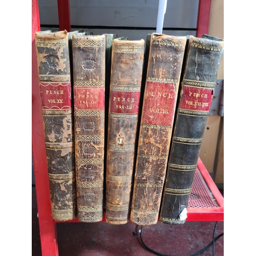 121 - 5 19th century large volumes of Punch cartoon , includes volumes 20, 14, 12, 18 and 15-16.