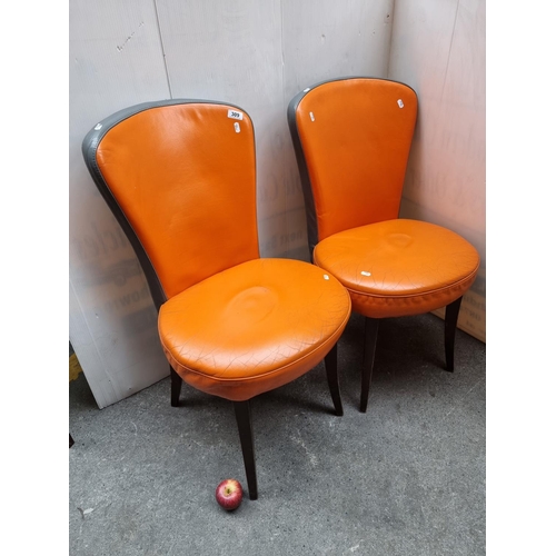 309 - Pair of Orange retro chairs. Good quality.