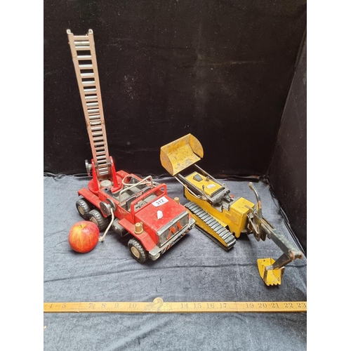 312 - Two vintage metal large scale vehicles; a Meccano fire truck and a yellow Tonka digger.