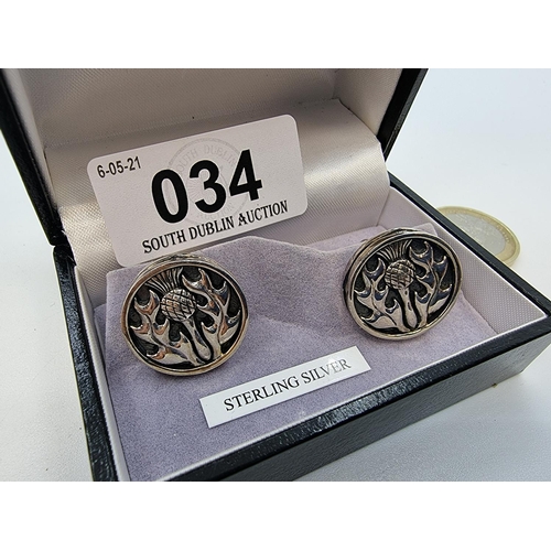 34 - Pair of sterling silver cufflinks with thistle design in box. Weight 15.8g (for pair).
