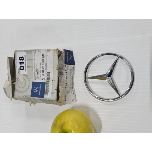 372 - Mercedes 2 x original parts 
A2107580058 rear boot lid badge 
Part phone kit holder for a 210 model