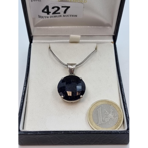 427 - Sterling silver circular Blue Goldstone gem pendant with lobster clasp.