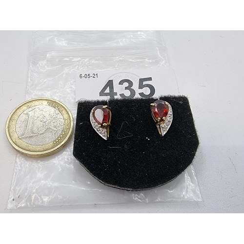 435 - Pair of 9 carat gold garnet and diamond stone stud earrings. Lovely pair of fine earrings