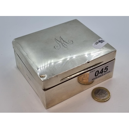 45 - Silver cigarette box with initial 'M' to lid, Chester with date mark rubbed. Weight 264g.