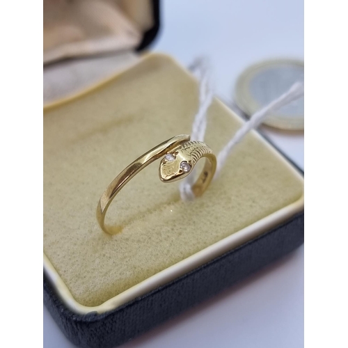 47 - 18 carat gold snakes head diamond ring. Size O, weight 1.6g.