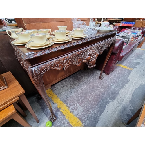 489 - A Mahogany Console Table with Queen Anne Legs, Ball and Claw Feet and Carved Decorative Front Panel