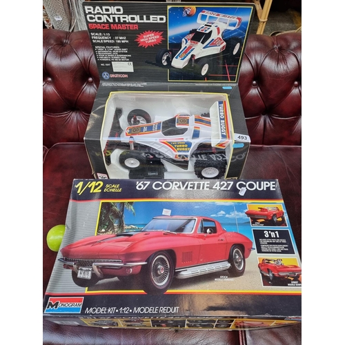 493 - A very large scale  1/12 scale 1967 Corvette 427 Coupe by Monogram and a Radio Controlled Dune Buggy... 