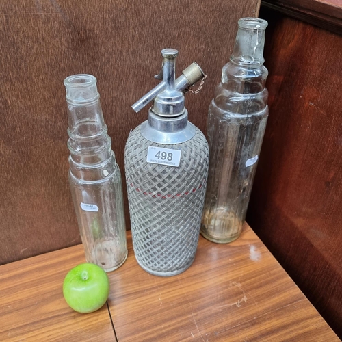 498 - 3 Vintage Bottles including a Wire Mesh Soda Syphon and 2 Esso Ireland Bottles