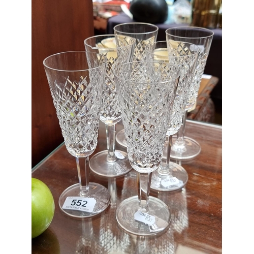 552 - Six Waterford Crystal champagne flutes.