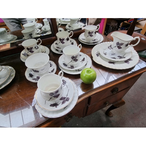 557 - China tea set including twenty pieces in total, with dark rose design. Stamped Mayfair Pottery, fine... 