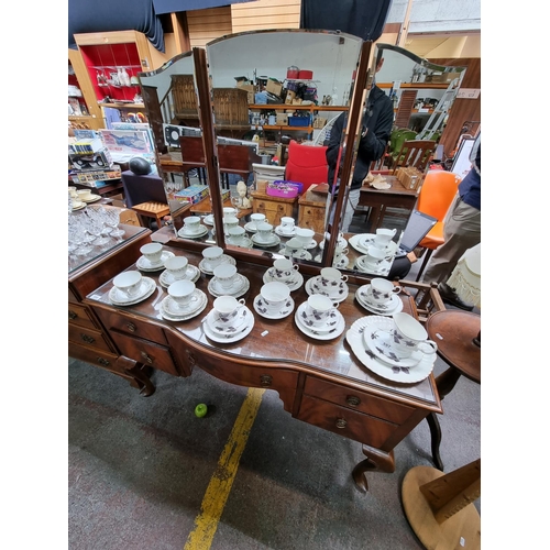 558 - Antique sit in dressing table with five drawers and  three panelled 180 degree mirror. Measures 148c... 