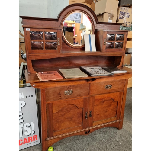 598 - Art Nouveau sideboard with boule bevelled glass and round bevelled mirror. In very good condition. 1... 