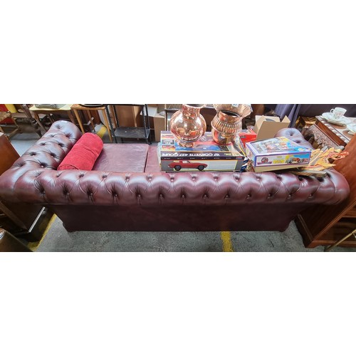 496 - A Super 3 Seater Ox Blood Chesterfield Couch, With Button Rolled back in good order