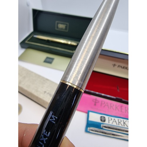 428 - 10 carat gold plated Cross ballpoint pen, in presentation box and two Parker fountain pens, both wit... 