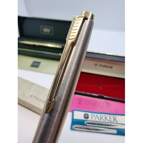 428 - 10 carat gold plated Cross ballpoint pen, in presentation box and two Parker fountain pens, both wit... 