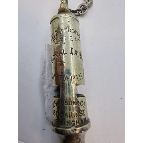 406 - An Irish Constabulary Metropolitan Police whistle with pocket chain. Manufactured by J. Hudson & Son... 