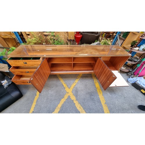 299 - Mid Century Rosewood sideboard with three drawers and two cupboards and a glass saver top. . Mm: 220... 