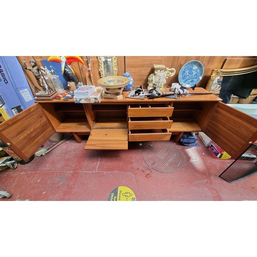 221 - Mid century teak sideboard. 76cm high, 212cm long, 43cm deep Nice example.