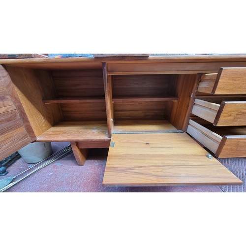 221 - Mid century teak sideboard. 76cm high, 212cm long, 43cm deep Nice example.