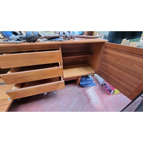 221 - Mid century teak sideboard. 76cm high, 212cm long, 43cm deep Nice example.