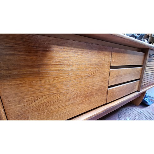 221 - Mid century teak sideboard. 76cm high, 212cm long, 43cm deep Nice example.