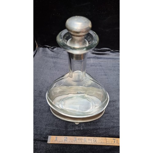 201 - Vintage glass decanter with silver toned base and stopper. Super shape has a great look.