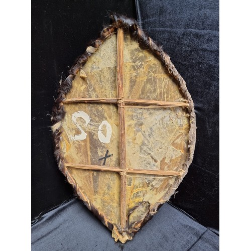 197 - Interesting vintage painted tribal shield made of animal hide and fur.