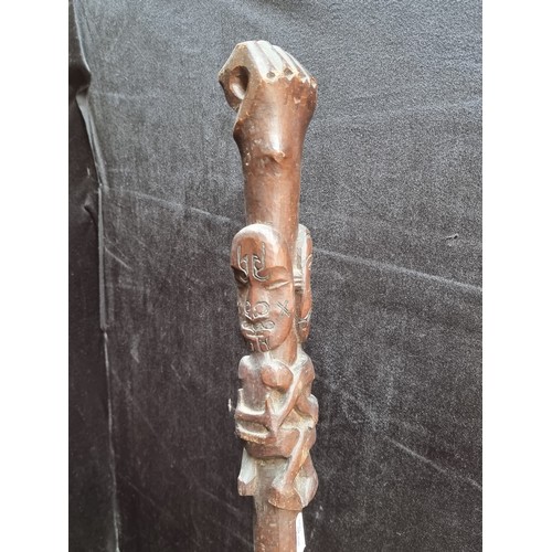 176 - Antique African tribal club with carved end and carved clenched fist