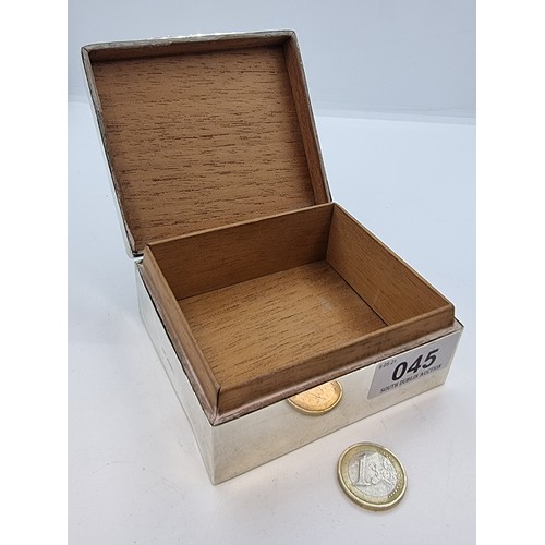45 - Silver cigarette box with initial 'M' to lid, Chester with date mark rubbed. Weight 264g.