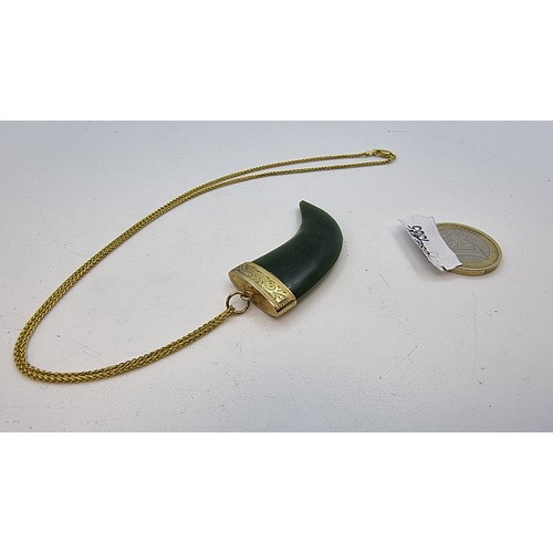 29 - 9 carat gold claw Jade pendant with gold setting. Weight of gold, 5.8g.