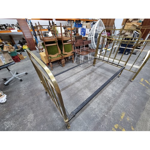 575 - Two vintage brass bed frames, including headboards, footboards (on wheels) and rails. 136cm wide and... 