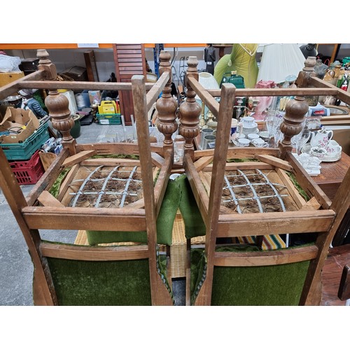 588 - Four antique wooden chairs with plush green upholstery in very good condition. Overall height is 87c... 