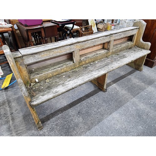 596 - Large antique wooden church pew. 90cm h x 207cm w x 42cm  Would be a great resto project.