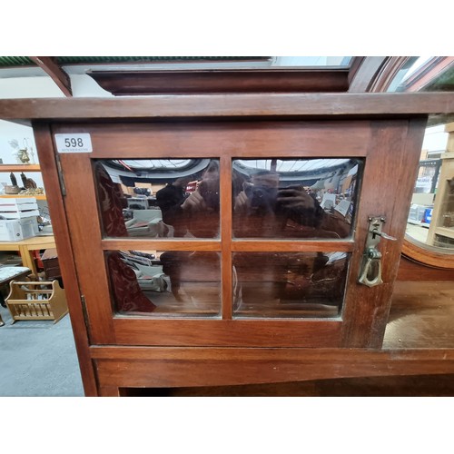 598 - Art Nouveau sideboard with boule bevelled glass and round bevelled mirror. In very good condition. 1... 