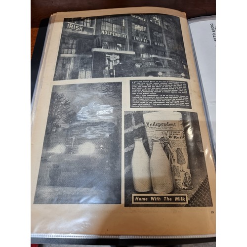 601 - Large Folio of Irish newspapers and magazines and other Irish ehemra good lot . Pages preserved in p... 