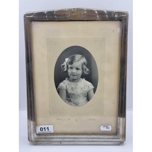 11 - A large Sterling silver framed photo entitled 