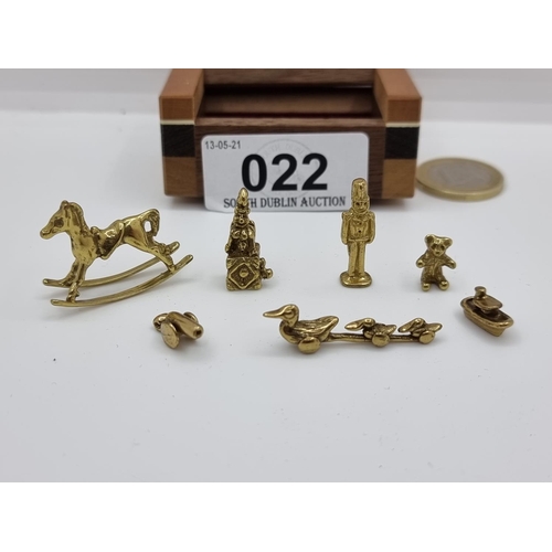 22 - A collection of 7 ornamental pieces, including a rocking horse figure, three ducks, a canon, a teddy... 