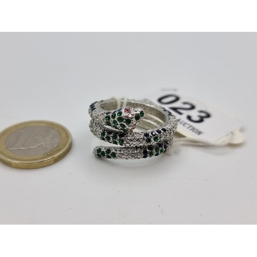 23 - A three row sterling silver snake designed ring with green and white gemstone set design with pink s... 