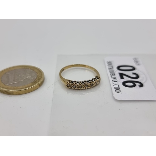 26 - A 9 carat gold gemset half eternity ring. Size N, weight 1.2g.