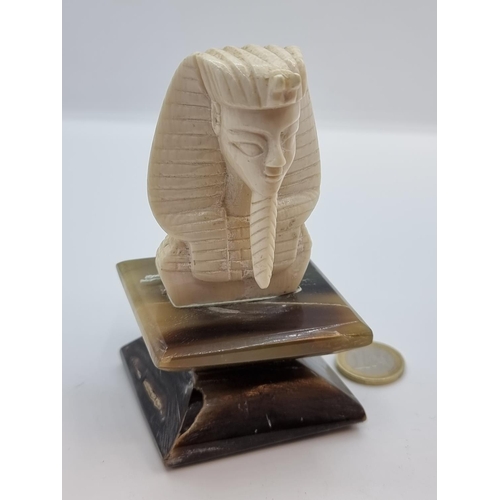 39 - Antique Carved ivory statuette of Egyptian bust on an onyx stand.
