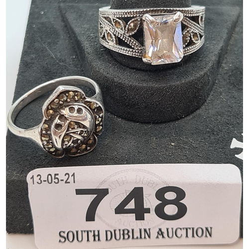 748 - Two Sterling Silver rings The marcasite ring has an engraved imaged of Mother Mary in the inside the... 