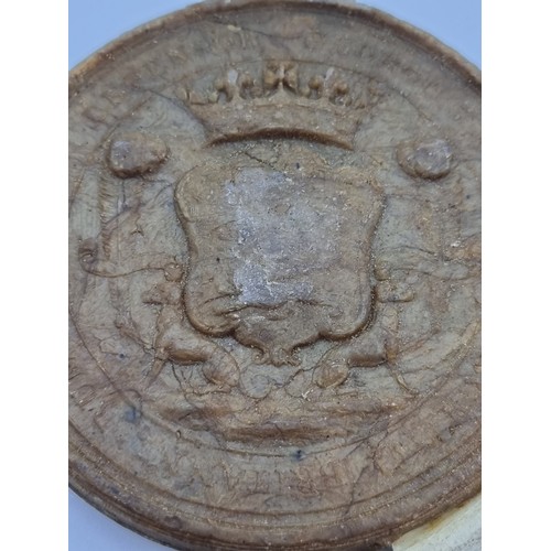 13 - A 19th century wax seal depicting knight on horseback with coat of arms to reverse. In original meta... 