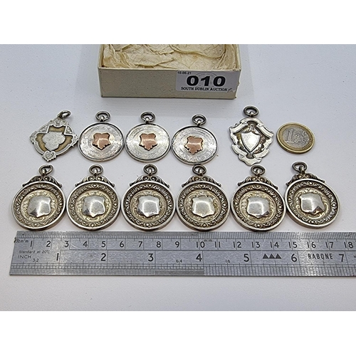 10 - A collection of eleven sterling silver medallions, seven of which for Speedway, and a further four f... 