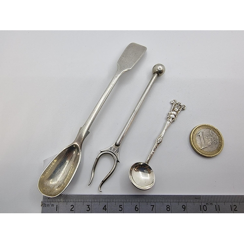 2 - Three sterling silver condiment pieces: a pickle fork marked sterling silver, an Irish mustard spoon... 