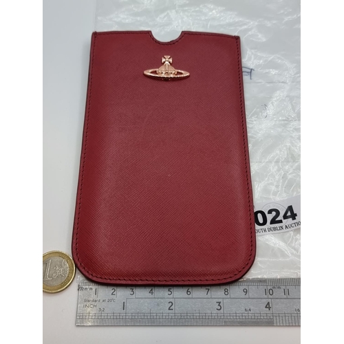 24 - A genuine leather Vivienne Westwood wallet. Maker's mark stamped to base. With a cross and orb detai... 