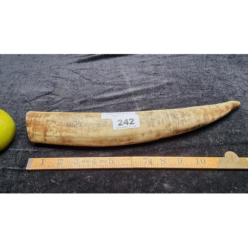 242 - An American Faux Scrimshaw Tusk with Engravings of an Eagle and Country Scene.