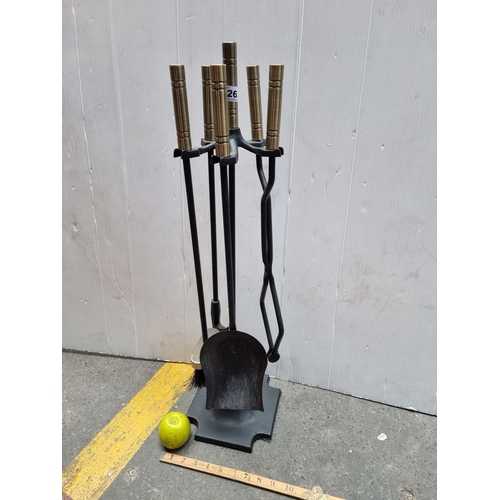 263 - A heavy metal Companion Set with Brass handles.